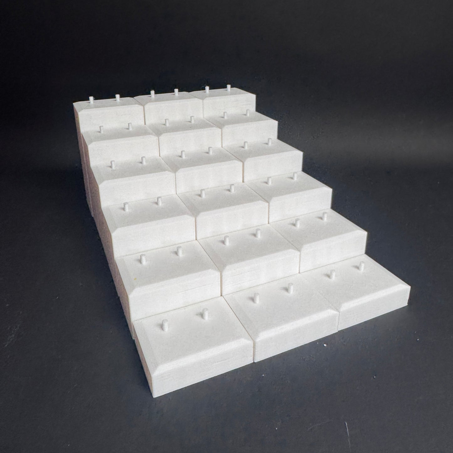 Interlocked Figure Floor bases arranged in a tiered setup