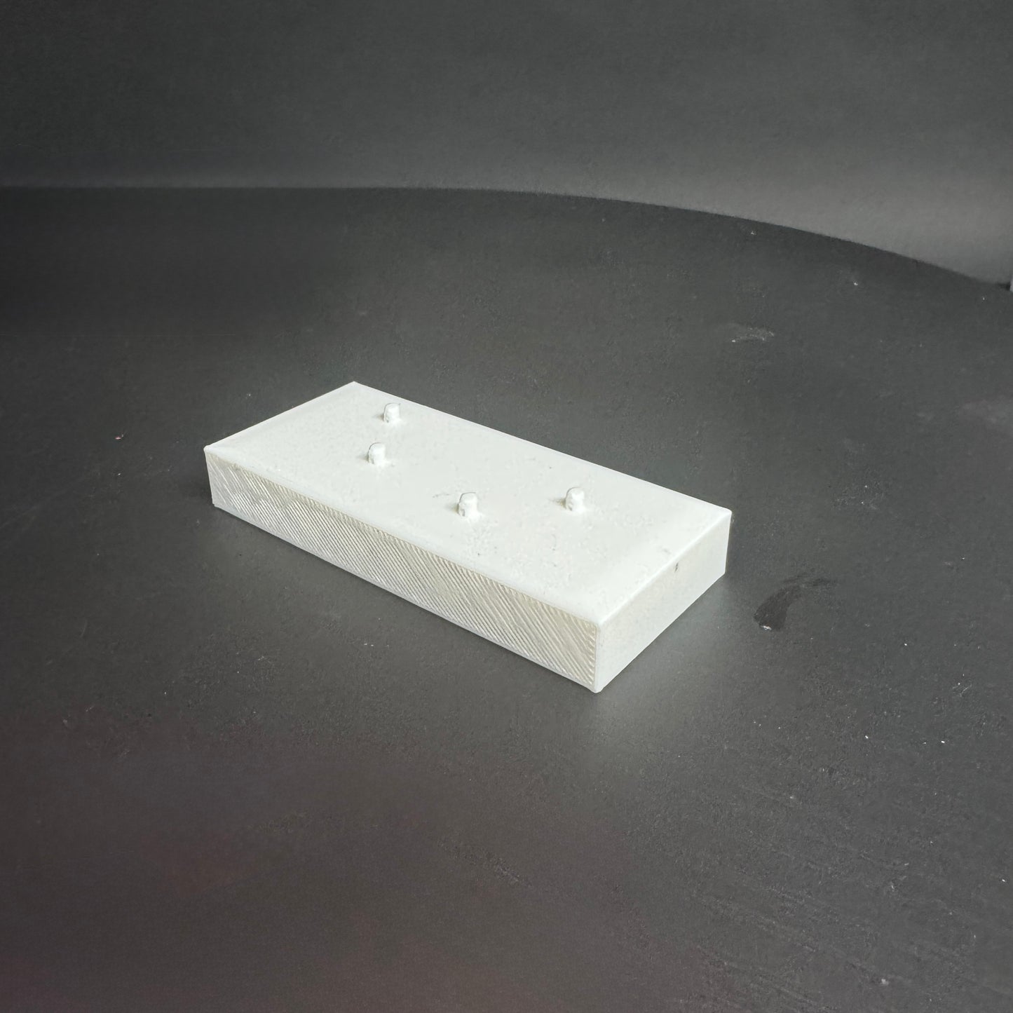 Figure Floor modular display block showing the interlocking edge design.