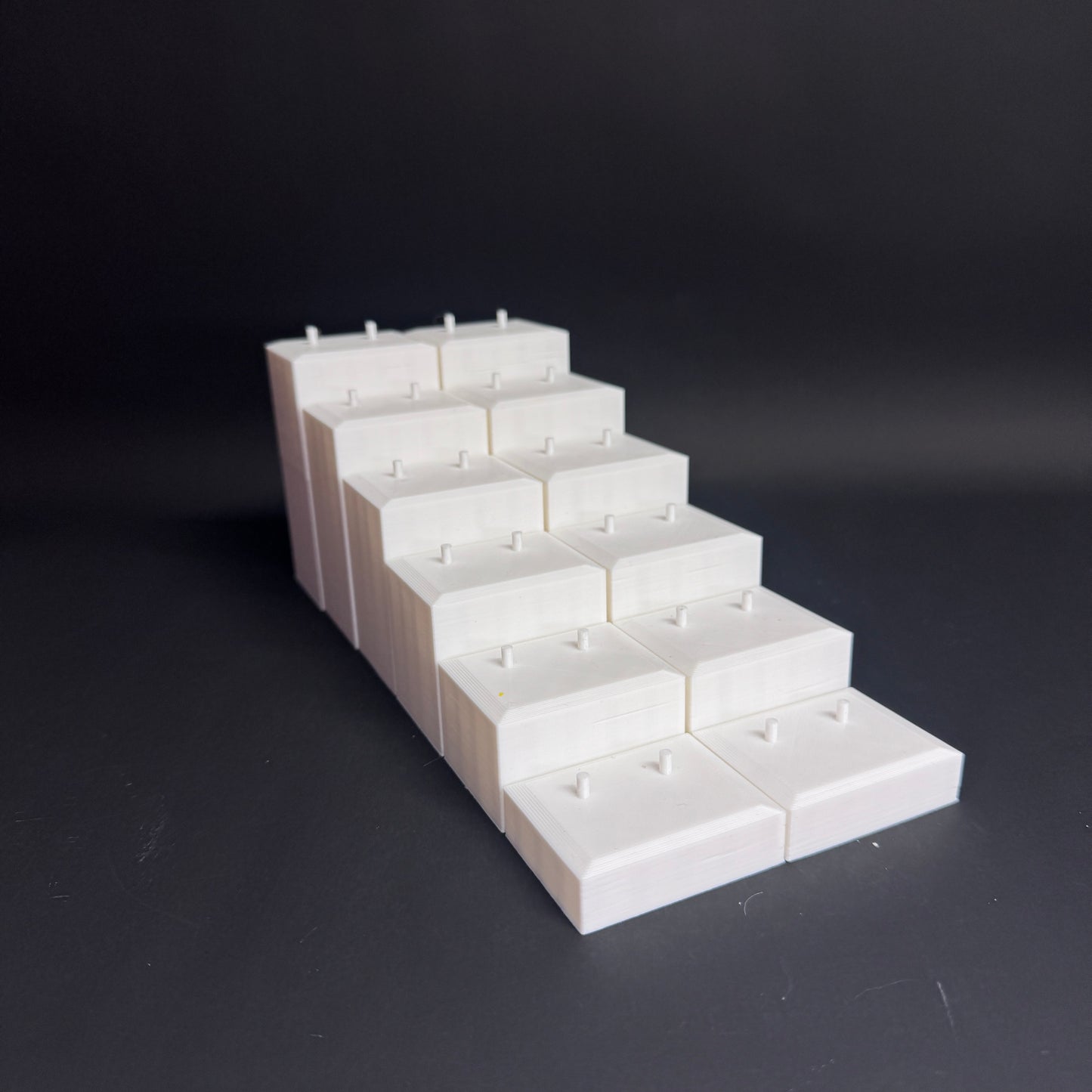 Interlocked Figure Floor bases arranged in a tiered setup