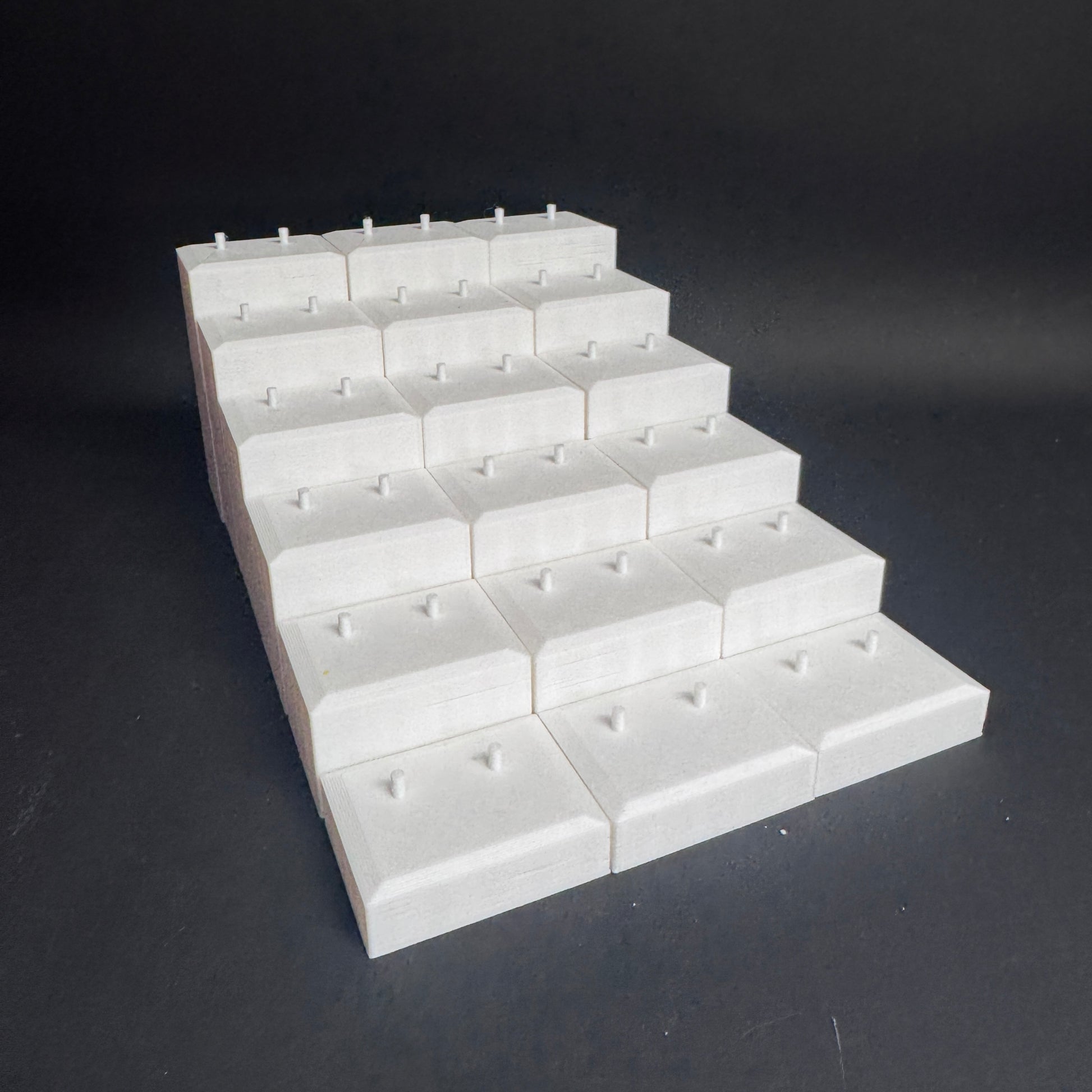 Interlocked Figure Floor bases arranged in a tiered setup