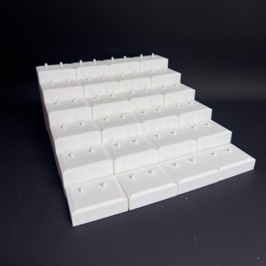 Interlocked Figure Floor bases arranged in a tiered setup