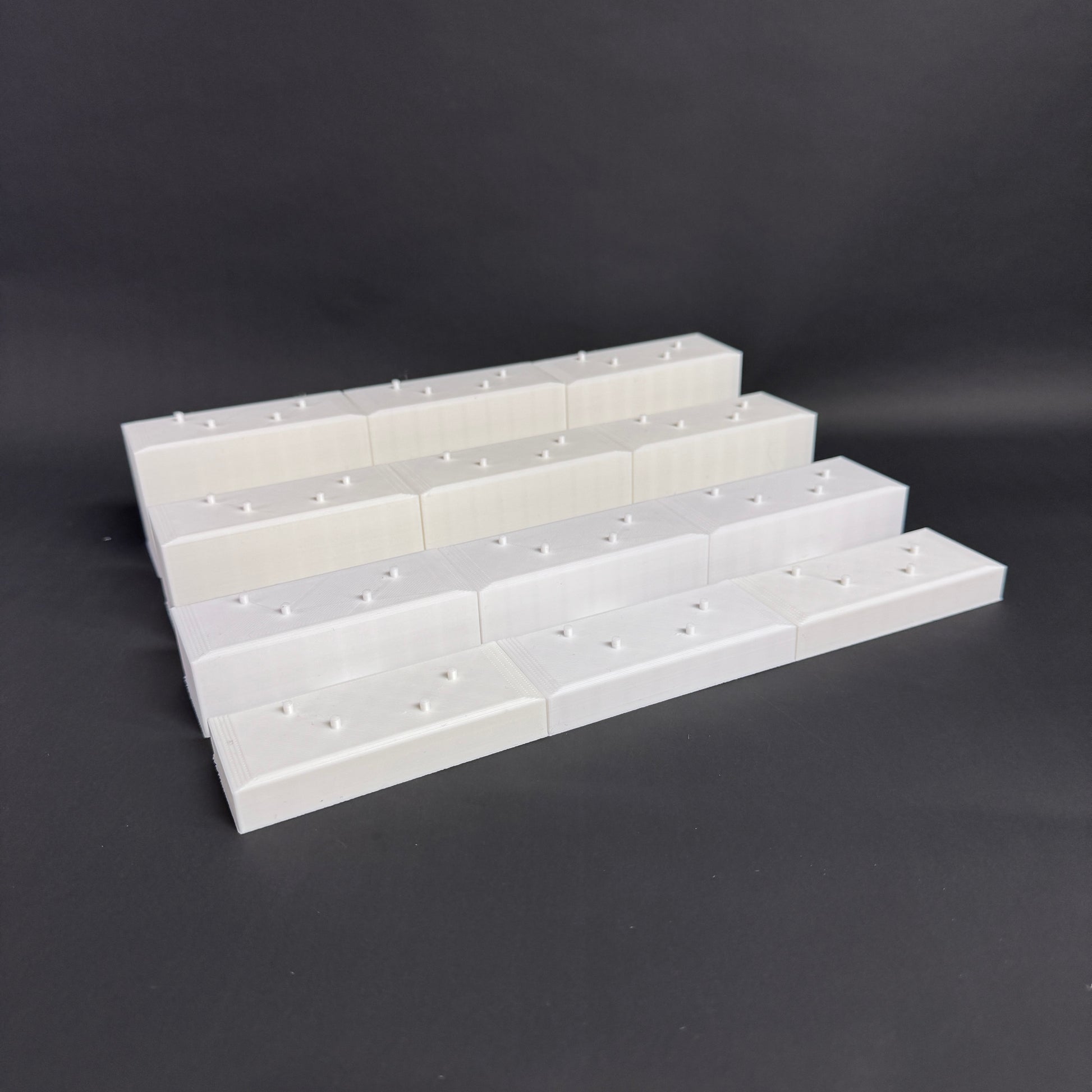 Interlocked Figure Floor bases arranged in a tiered setup