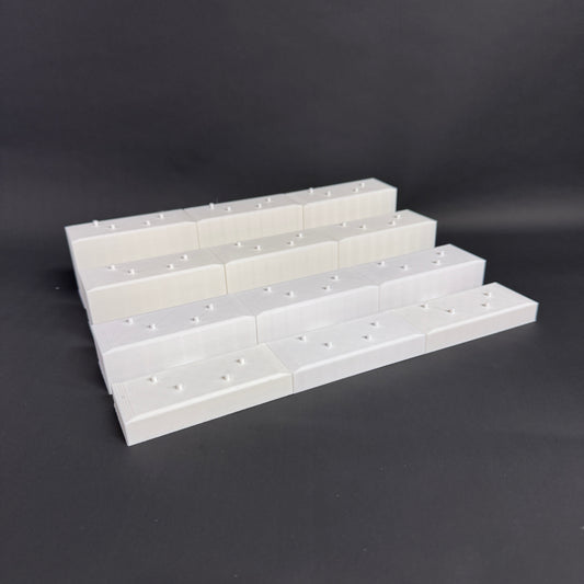 Interlocked Figure Floor bases arranged in a tiered setup