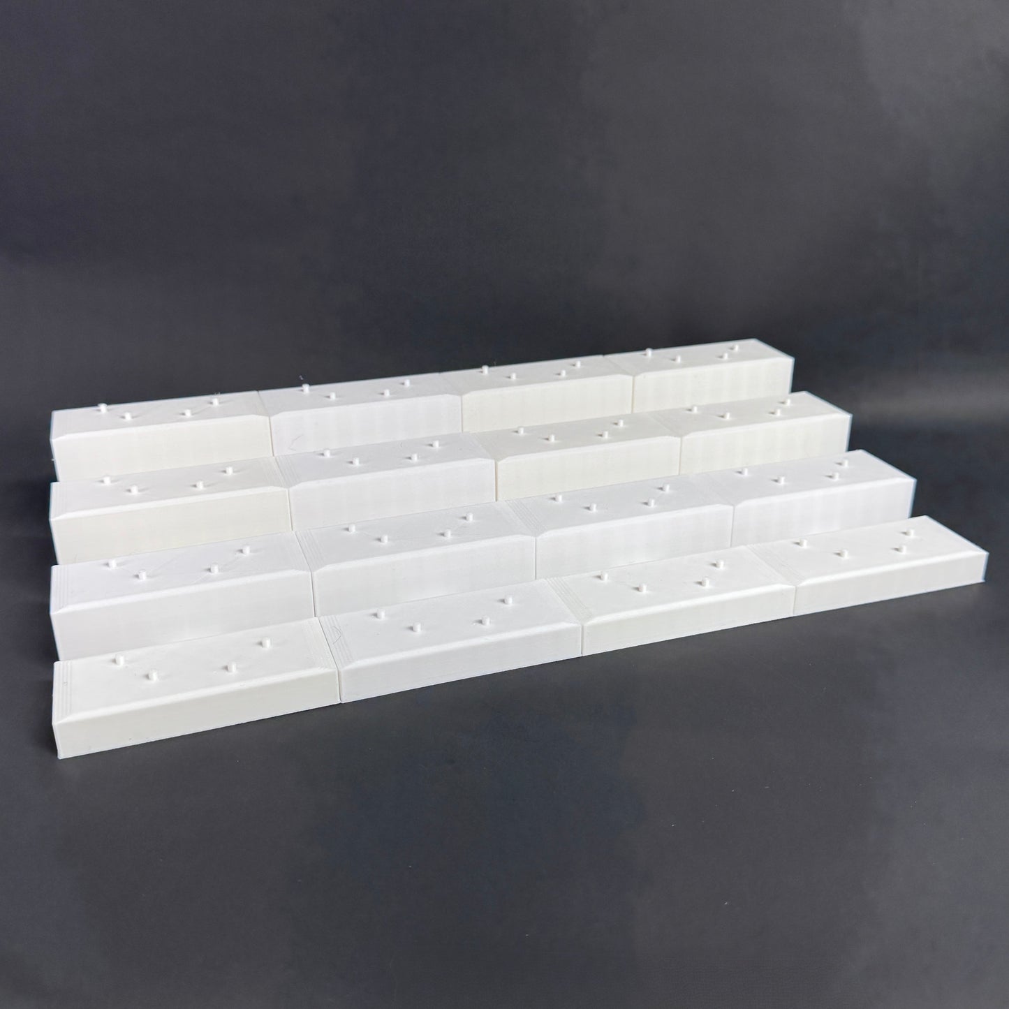 Interlocked Figure Floor bases arranged in a tiered setup